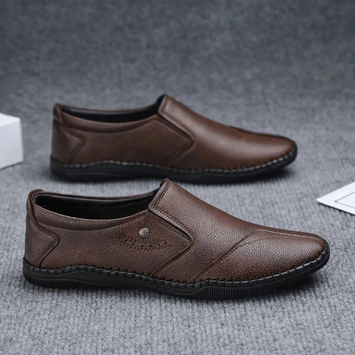 Men's brown synthetic leather slip-on shoes with round toe - side view